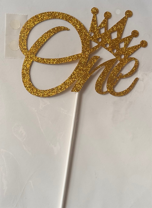 Word One gold paper cake topper