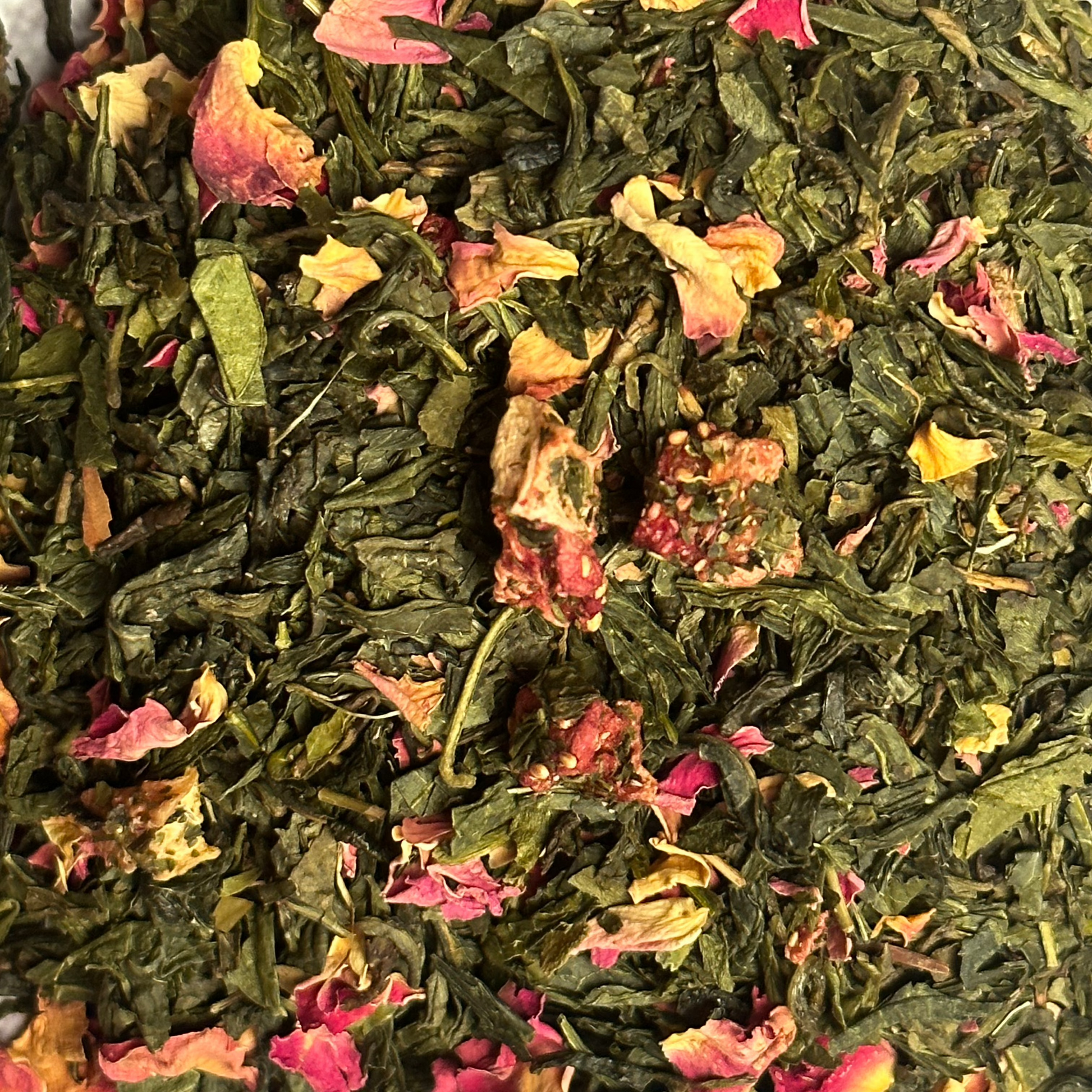 Angelina  loose green tea dubai Loose-leaf green tea  and rose petals in natural dried form—herbal wellness tea by Rawsome Foods.