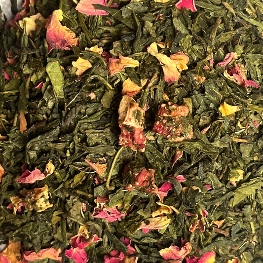 Angelina loose green tea dubai Loose-leaf green tea and rose petals in natural dried form—herbal wellness tea by Rawsome Foods.