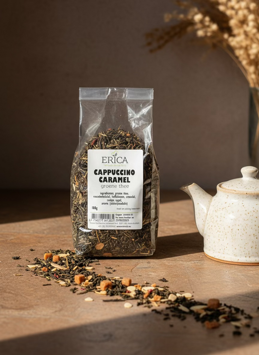 Bag of Erica Cappuccino Caramel green tea with a plant in the background