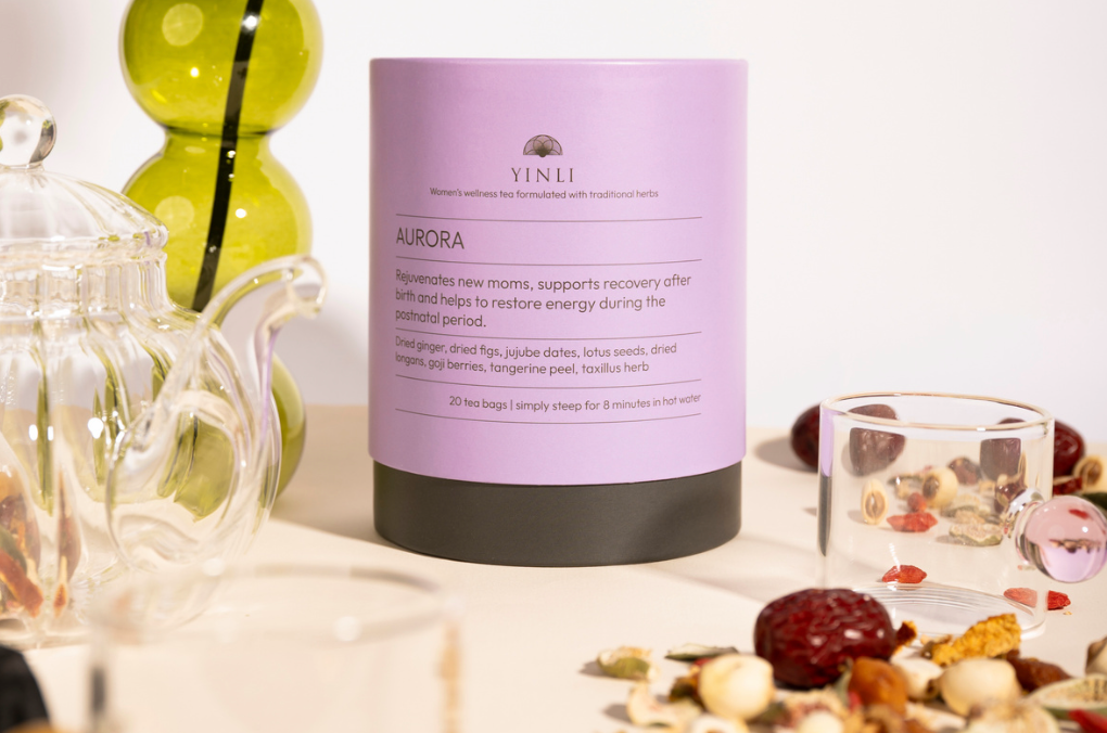 Yinxi Aurora product on a table with tea accessories