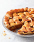 Apple pie with a slice removed on a white plate