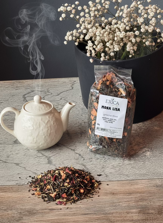 Bag of Erica Mona Lisa green tea with a label on a stone surface.