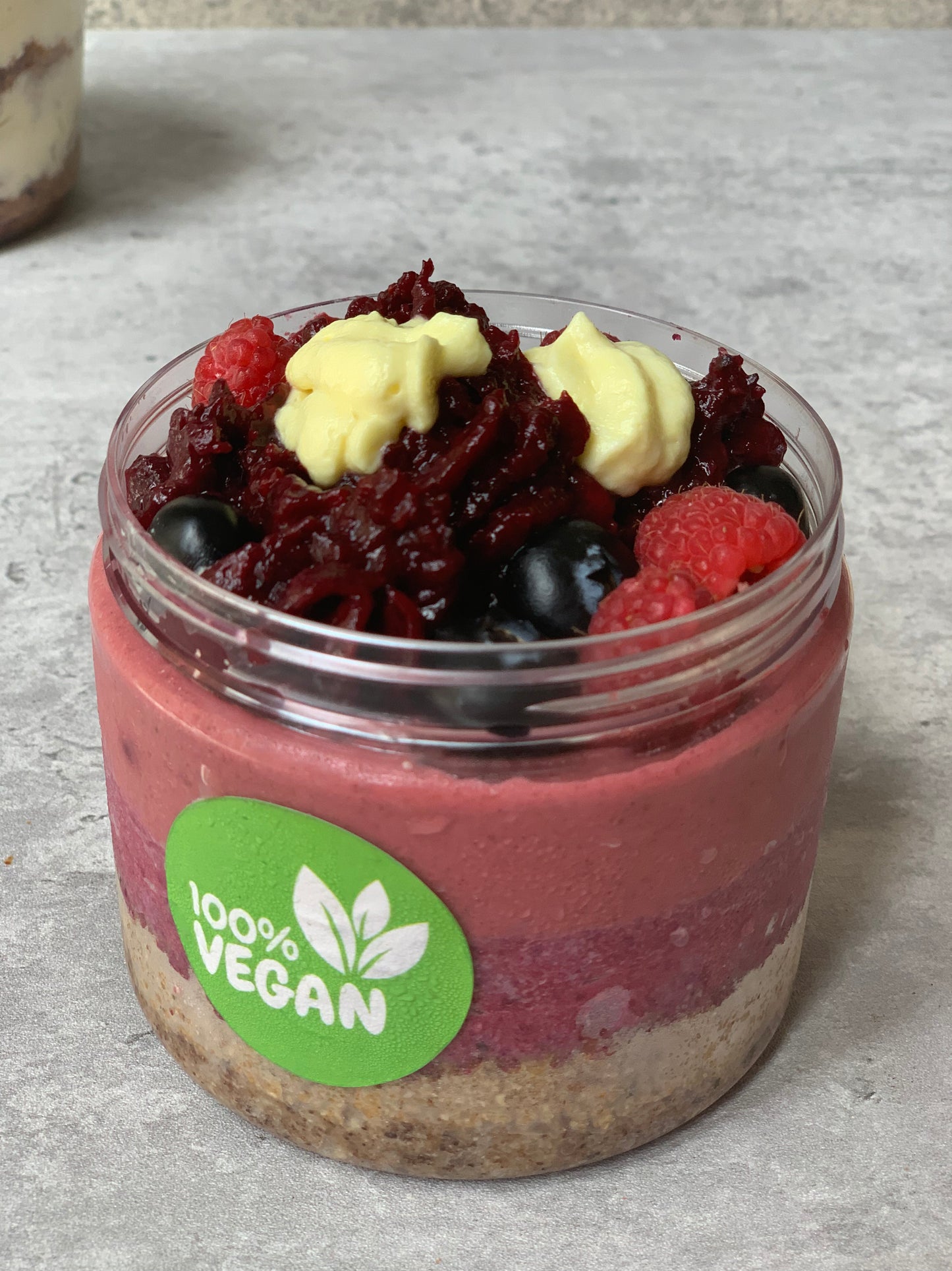 Vegan berry cheesecake granola in a cup